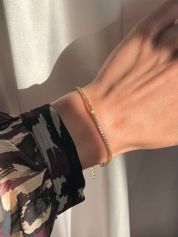 Thin gold tennis bracelet
