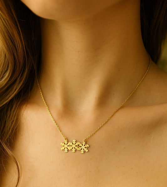 Gold snowflakes necklace